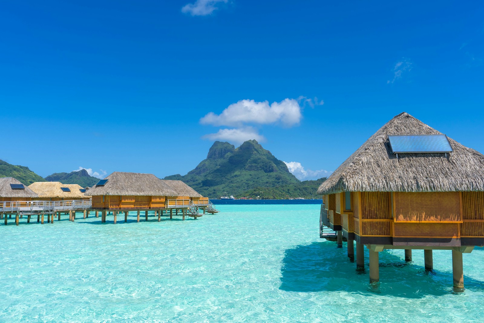 Overwater bungalows above the turquoise lagoon in Bora Bora