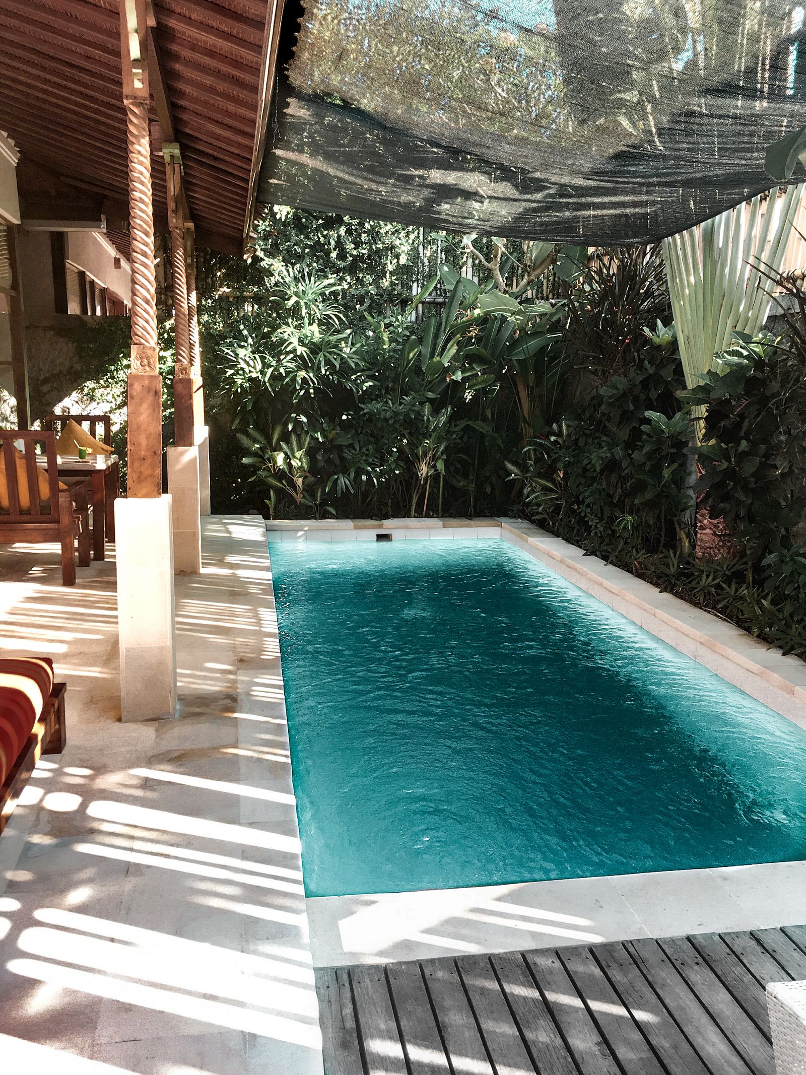 Secluded courtyard pool beside a tropical villa