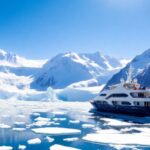 Luxury yacht amidst Antarctica's stunning icy landscape.