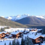 Resort de esqui de luxo com montanhas cobertas de neve e chalés.