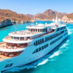 Luxury cruise ship on turquoise waters with happy passengers.