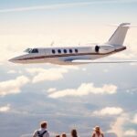 Private jet flying over scenic landscape with family vacationing.