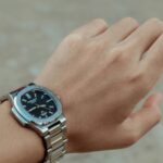 A person with a watch on their wrist