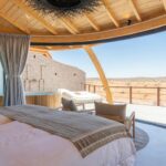 a bedroom with a view of the desert