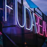 closeup photo of lighted Hudabeauty neon signage