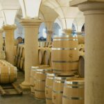 A large room filled with lots of wooden barrels