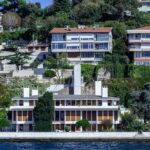a house on a hill overlooking a body of water