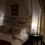 Florence Palazzo Suites Best for After-Hours Uffizi Access white bed linen near brown wooden nightstand