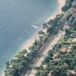 a bird's eye view of a small town by the ocean