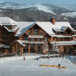 a ski lodge with a lot of snow on the ground
