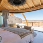 a bedroom with a view of the desert