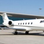 Private jet at a Middle Eastern airport tarmac.