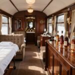 Luxury train carriage with spa and whisky tasting area.