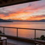 Suite balcony overlooking Lake Titicaca at sunset.
